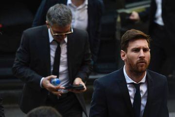 Barcelona's football star Lionel Messi (R) followed by his father Jorge Horacio Messi.