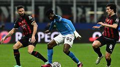 (From L) AC Milan's French forward Olivier Giroud, Napoli's Cameroonian midfielder Andre Zambo Anguissa and AC Milan's Italian midfielder Sandro Tonali go for the ball during the UEFA Champions League quarter-finals first leg football match between AC Milan and SSC Napoli on April 12, 2023 at the San Siro stadium in Milan. (Photo by GABRIEL BOUYS / AFP) (Photo by GABRIEL BOUYS/AFP via Getty Images)