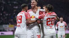 Leipzig's Slovenian forward #30 Benjamin Sesko (2nd L) celebrates scoring the 2-0 goal with his team-mates during the German first division Bundesliga football match between RB Leipzig and Union Berlin in Leipzig, eastern Germany on February 4, 2024. (Photo by Ronny HARTMANN / AFP) / DFL REGULATIONS PROHIBIT ANY USE OF PHOTOGRAPHS AS IMAGE SEQUENCES AND/OR QUASI-VIDEO