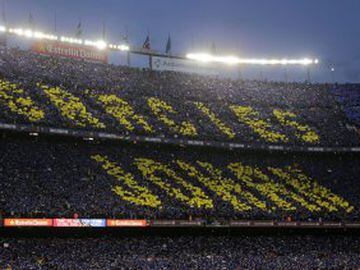 Fans hold up a mosaic of 90,000 cards with the slogan reading in Catalan: Thank you Johan' during a tribute to the late Dutch soccer star Johan Cruyff at the beginning of during a Spanish