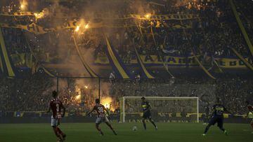 Boca Juniors fans light flares from the stands during a local tournament soccer match against Union de Santa Fe in Buenos Aires, Argentina, Sunday, June 25, 2017