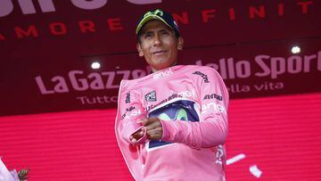 Colombia&#039;s Nairo Quintana of team Movistar celebrates the pink jersey of the overall leader on the podium after winning the 9th stage of the 100th Giro d&#039;Italia, Tour of Italy, cycling race from Montenero di Bisaccia to Blockhaus on May 14, 2017.  Colombia&#039;s Nairo Quintana soared to victory on a dramatic ninth stage of the Giro d&#039;Italia on Sunday to claim the race leader&#039;s pink jersey. Movistar&#039;s Quintana came over the finish line 23secs ahead of Frenchman Thibaut Pinot and Dutchman Tom Dumoulin, to wrest the race lead from Luxembourg&#039;s Bob Jungels.  / AFP PHOTO / Luk BENIES