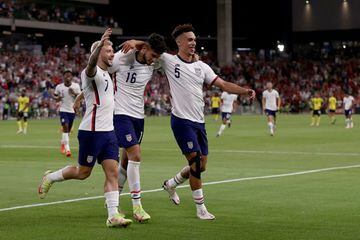 Ricardo Pepi (centre) celebrates with Paul Arriola (left) and Antonee Robinson as his double secured a 2-0 win for the USMNT over Jamaica.