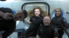 (FILES) In this file photo taken on September 16, 2021 courtesy of Inspiration4 shows the Inspiration4 crew (L-R) Jared Isaacman, Hayley Arceneaux, Christopher Sembroski and Sian Proctor in orbit. - The four private space tourists aboard a SpaceX capsule 