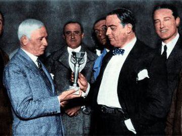 Raúl Jude, president of the Uruguay Football Association, is presented with the Jules Rimet trophy after the hosts defeated Argentina in the final.