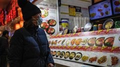 A person looks at a food kiosk serving Korean food in the Queens borough of New York City on January 27, 2022.