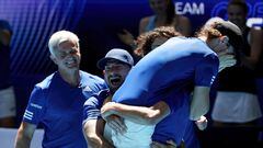 Greece's Stefanos Sakellaridis (R) celebrates with teammates after winning against Zizou Bergs of Belgium during their men�s single match on day six of the United Cup tennis tournament in Perth on January 3, 2023. (Photo by COLIN MURTY / AFP) / -- IMAGE RESTRICTED TO EDITORIAL USE - STRICTLY NO COMMERCIAL USE --
