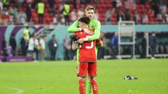 DOHA, QATAR - NOVEMBER 21: Wales goalkeeper Wayne Hennessey and Neco Williams of Wales embrace at the end of the FIFA World Cup Qatar 2022 Group B match between USA and Wales at Ahmad Bin Ali Stadium on November 21, 2022 in Doha, Qatar. (Photo by Jean Catuffe/Getty Images)