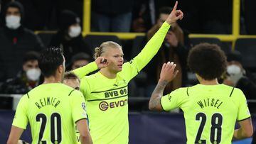 DORTMUND, GERMANY - DECEMBER 07: Erling Haaland of Dortmund celebrates scoring the fourth goal with Axel Witsel and Reiner during the UEFA Champions League group C match between Borussia Dortmund and Besiktas at Signal Iduna Park on December 07, 2021 in D