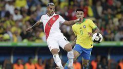 Peru&#039;s Miguel Angel Trauco, left, fights for the ball with Brazil&#039;s Gabriel Jesus during the final match of the Copa America at Maracana stadium in Rio de Janeiro, Brazil, Sunday, July 7, 2019. (AP Photo/Silvia Izquierdo)