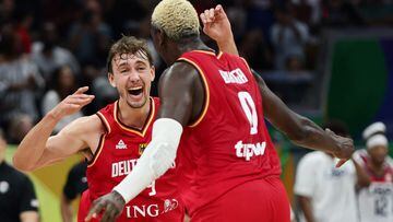 Basketball - FIBA World Cup 2023 - Semi Final - United States v Germany - Mall of Asia Arena, Manila, Philippines - September 8, 2023 Germany's Franz Wagner and Isaac Bonga celebrate after the match REUTERS/Eloisa Lopez