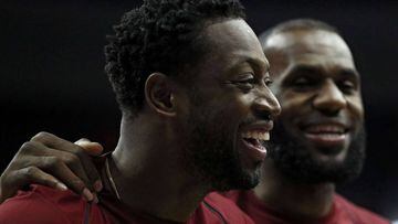 WASHINGTON, DC - OCTOBER 08: Dwyane Wade #9 and LeBron James #23 of the Cleveland Cavaliers share a laugh during a stop in play against the Washington Wizards in the first half during a preseason game at Capital One Arena on October 8, 2017 in Washington, DC. NOTE TO USER: User expressly acknowledges and agrees that, by downloading and or using this photograph, User is consenting to the terms and conditions of the Getty Images License Agreement.   Patrick Smith/Getty Images/AFP == FOR NEWSPAPERS, INTERNET, TELCOS &amp; TELEVISION USE ONLY ==