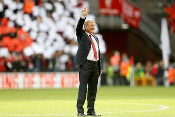 Kenny Dalglish salutes the fans before the match.