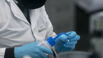 GARIN, ARGENTINA - AUGUST 13: A laboratory worker handles essay tubes at the production plant of mAbxience biotechnology company on August 13, 2020 in Gar&iacute;n, Argentina. The Argentina lab, property of Grupo Insud, will co-manufacture with Mexico the
