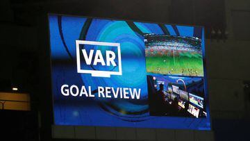The big screen displays a message as a goal is reviewed by VAR  