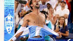 Aug 20, 2023; Mason, OH, USA; Novak Djokovic, of Serbia, rips his shirt in celebration after defeating Carlos Alcaraz, of Spain, at the conclusion of the men?s singles final of the Western & Southern Open tennis tournament at Lindner Family Tennis Center. Mandatory Credit: Kareem Elgazzar/The Enquirer-USA TODAY Sports     TPX IMAGES OF THE DAY