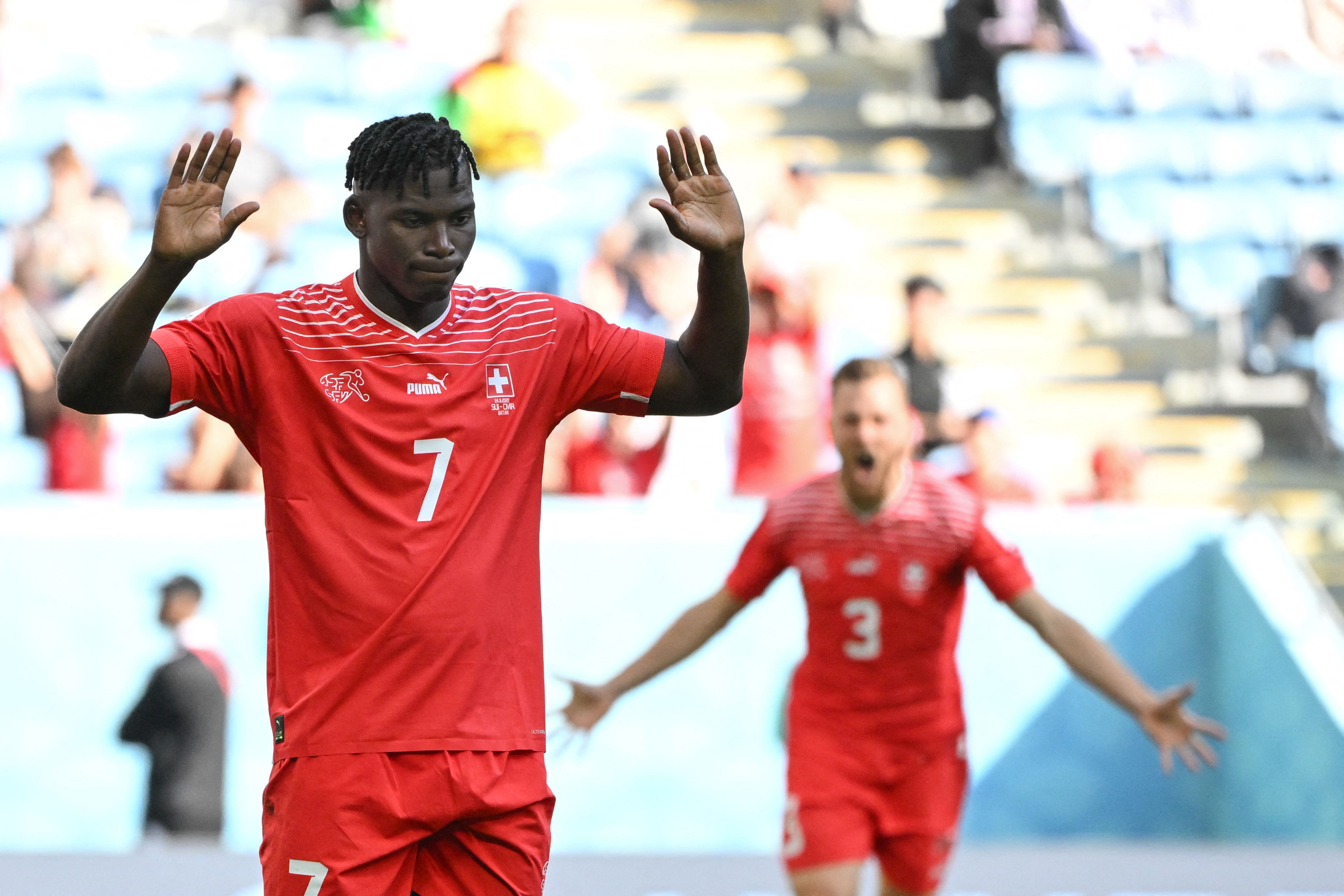 Switzerland's forward #07 Breel Embolo celebrates scoring his team's first goal during the Qatar 2022 World Cup Group G football match between Switzerland and Cameroon at the Al-Janoub Stadium in Al-Wakrah, south of Doha on November 24, 2022. (Photo by FABRICE COFFRINI / AFP)