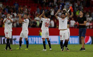Sevilla’s players applaud the fans at the end of the match