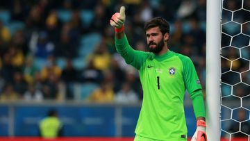 PORTO ALEGRE, BRAZIL - JUNE 27: Alisson Becker of Brazil gives a thumb up during the Copa America Brazil 2019 quarterfinal match between Brazil and Paraguay at Arena do Gremio on June 27, 2019 in Porto Alegre, Brazil. (Photo by Alessandra Cabral/Getty Images)