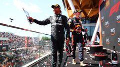 MONTREAL, QUEBEC - JUNE 19: Third placed Lewis Hamilton of Great Britain and Mercedes celebrates on the podium with race winner Max Verstappen of the Netherlands and Oracle Red Bull Racing after the F1 Grand Prix of Canada at Circuit Gilles Villeneuve on June 19, 2022 in Montreal, Quebec. (Photo by Dan Istitene - Formula 1/Formula 1 via Getty Images)