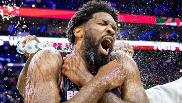 Philadelphia 76ers center Joel Embiid (21) is doused with water by teammates after scoring 70 points in a victory against the San Antonio Spurs at Wells Fargo Center.