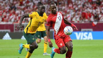 Australia's forward Awer Mabil (L) vies for the ball with Peru's defender Luis Advincula during the FIFA World Cup 2022 inter-confederation play-offs match between Australia and Peru on June 13, 2022, at the Ahmed bin Ali Stadium in the Qatari city of Ar-Rayyan. (Photo by KARIM JAAFAR / AFP) (Photo by KARIM JAAFAR/AFP via Getty Images)