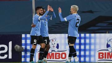 Uruguay's Diego Rossi (L) celebrates with teammates after scoring the team fifth goal against Panama during their friendly football match ahead of the FIFA World Cup Qatar 2022, at the Centenario stadium in Montevideo, on June 11, 2022. (Photo by PABLO PORCIUNCULA / AFP)