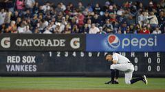 NEW YORK, NY - SEPTEMBER 03: Aaron Judge #99 of the New York Yankees takes a knee before the start of a game against the Boston Red Sox at Yankee Stadium on September 3, 2017 in the Bronx borough of New York City.   Rich Schultz/Getty Images/AFP == FOR N