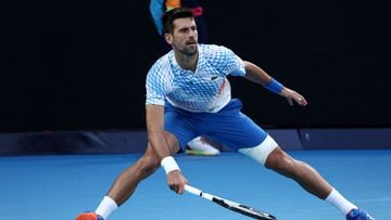 Serbia's Novak Djokovic hits a return against Russia's Andrey Rublev during their men's singles quarter-final match on day ten of the Australian Open tennis tournament in Melbourne on January 25, 2023. (Photo by DAVID GRAY / AFP) / -- IMAGE RESTRICTED TO EDITORIAL USE - STRICTLY NO COMMERCIAL USE --