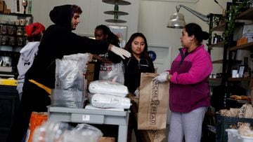 FILE PHOTO: Employees laid off from Farley&rsquo;s East cafe, that closed due to the financial crisis caused by the coronavirus disease (COVID-19), collect food items at the cafe in Oakland, California, U.S. March 18, 2020. Picture taken March 18, 2020. R