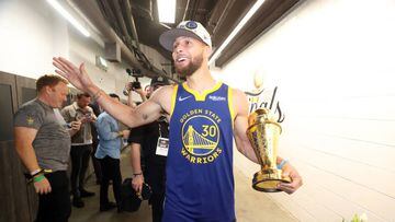 BOSTON, MA - JUNE 16: Stephen Curry #30 of the Golden State Warriors looks on and smiles with the Bill Russell NBA Finals MVP Award after Game Six of the 2022 NBA Finals on June 16, 2022 at TD Garden in Boston, Massachusetts. NOTE TO USER: User expressly acknowledges and agrees that, by downloading and or using this photograph, user is consenting to the terms and conditions of Getty Images License Agreement. Mandatory Copyright Notice: Copyright 2022 NBAE (Photo by Nathaniel S. Butler/NBAE via Getty Images)