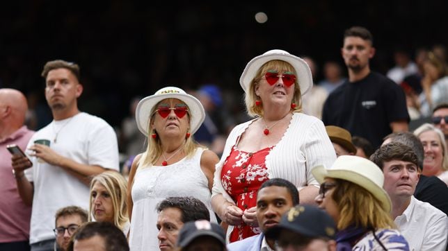 Why do fans eat strawberries and cream at Wimbledon?