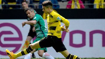 Marc Bartra keeps Bremen midfielder Fin Bartels in check in his first competitive return in today&#039;s final game of the season
