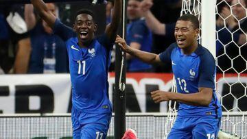 France&#039;s forward Ousmane Dembele (L) celebrates with teammate midfielder Kylian Mbappe after scoring during the international friendly football match between France and England at The Stade de France Stadium in Saint-Denis near Paris on June 13, 2017