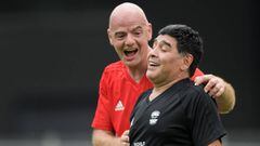 FIFA President Gianni Infantino (L) congratulates former Argentinian football star Diego Maradona after he scored a goal during &quot;The Gianni&#039;s game, the match of legends&quot;, a football match with football legends in honour of FIFA&#039;s President on July 7, 2017 in Brig. / AFP PHOTO / Fabrice COFFRINI