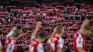 (FILES) In this file photo taken on March 08, 2019 FC Union Berlin players wave as supporters display their scarves prior to the 2nd division Bundesliga match FC Union Berlin vs FC Ingolstadt 04 at the stadium An der Alten Foersterei in Berlin. - FC Bayer