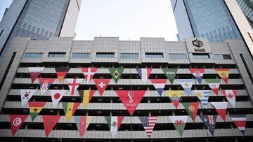 Flags of the competing countries are displayed on a building in Doha on November 13, 2022, ahead of the Qatar 2022 World Cup football tournament. (Photo by Paul ELLIS / AFP) (Photo by PAUL ELLIS/AFP via Getty Images)
