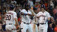 HOUSTON, TEXAS - JUNE 03: Alex Bregman #2 of the Houston Astros receives a high five from Yordan Alvarez #44 and Chas McCormick after hitting a grand slam in the fourth inning against the Los Angeles Angels at Minute Maid Park on June 03, 2023 in Houston, Texas.   Bob Levey/Getty Images/AFP (Photo by Bob Levey / GETTY IMAGES NORTH AMERICA / Getty Images via AFP)