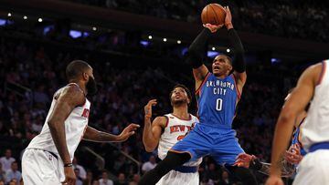 Nov 28, 2016; New York, NY, USA; Oklahoma City Thunder guard Russell Westbrook (0) shoots in front of New York Knicks guard Derrick Rose (25) during the first half at Madison Square Garden. Mandatory Credit: Adam Hunger-USA TODAY Sports