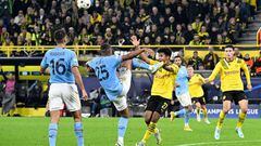 Manchester City's Swiss defender Manuel Akanji (2L) and Dortmund's German forward Karim Adeyemi (C) vie for the ball during the UEFA Champions League Group G football match between Borussia Dortmund and Manchester City in Dortmund, western Germany on October 25, 2022. (Photo by Roberto Pfeil / AFP) (Photo by ROBERTO PFEIL/AFP via Getty Images)