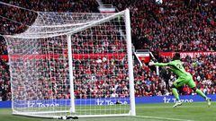 Lens' French forward Florian Sotoca scores past Manchester United's Cameroonian goalkeeper Andre Onana the first goal of his team during the pre-season friendly football match between Manchester United and Lens at Old Trafford stadium, in Manchester, on August 5, 2023. (Photo by Darren STAPLES / AFP)