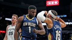 Zion Williamson #1 of the New Orleans Pelicans reacts with Jose Alvardo #15 of the New Orleans Pelicans after he scored over a host of San Antonio Spurs defenders in the first half at AT&T Center on November 23, 2022 in San Antonio, Texas.
