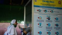 A health official collects nasal and throat swab samples from a nun to test for the Covid-19 coronavirus at a primary health centre  in Siliguri on September 2, 2020. - India on August 30 set a coronavirus record when it reported 78,761 new infections in 