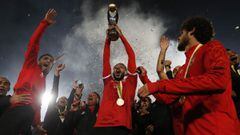 Soccer Football - African Champions League Final - Zamalek v Al Ahly - Cairo International Stadium, Cairo, Egypt - November 27, 2020  Al Ahly&#039;s Kahraba celebrates with the trophy and teammates after winning the final REUTERS/Amr Abdallah Dalsh