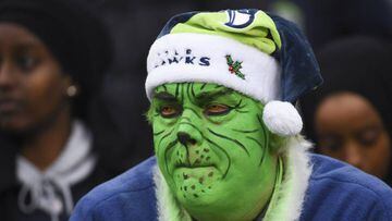 SEATTLE, WA - DECEMBER 17: A Seahawks fan in Grinch makeup watches the game during the third quarter against the Los Angeles Rams at CenturyLink Field on December 17, 2017 in Seattle, Washington.   Steve Dykes/Getty Images/AFP == FOR NEWSPAPERS, INTERNET, TELCOS &amp; TELEVISION USE ONLY ==