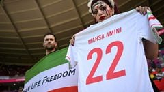 An Iranian fan holds a jersey in memory of Mahsa Amini, inside the stadium before the matc against Wales last week.