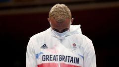 Tokyo 2020 Olympics -   Boxing - Men&#039;s Light Heavyweight - Medal Ceremony - Kokugikan Arena - Tokyo, Japan - August 4, 2021 -  Silver medallist Benjamin Whittaker of Britain looks dejected during the medal ceremony. Pool via REUTERS/Buda Mendes