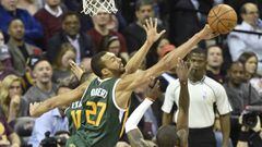 Mar 16, 2017; Cleveland, OH, USA; Utah Jazz center Rudy Gobert (27) blocks a shot by Cleveland Cavaliers guard Kyrie Irving (2) in the third quarter at Quicken Loans Arena. Mandatory Credit: David Richard-USA TODAY Sports