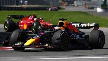MONTREAL, QUEBEC - JUNE 19: Max Verstappen of the Netherlands driving the (1) Oracle Red Bull Racing RB18 leads Carlos Sainz of Spain driving (55) the Ferrari F1-75 during the F1 Grand Prix of Canada at Circuit Gilles Villeneuve on June 19, 2022 in Montreal, Quebec. (Photo by Lars Baron - Formula 1/Formula 1 via Getty Images)