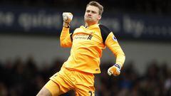 Liverpool&#039;s Simon Mignolet punches the air after Firmino put the Reds ahead at West Brom.